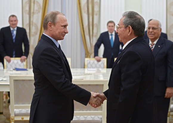 Russian President Vladimir Putin, left, and Cuban President Raul Castro shake hands during their meeting in the Kremlin in Moscow, Thursday, May 7, 2015. Raul Castro arrived in Moscow to attend celebrations marking the 70th anniversary of the victory over Nazi Germany in World War II. (Alexei Nikolsky/RIA-Novosti, Kremlin Pool Photo via AP)