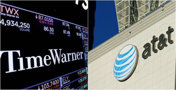 El logo de Time Warner en una pantalla en la Bolsa en Nueva York y el de AT&T, en un edificio en el centro de Los Ángeles. Imagen: Reuters