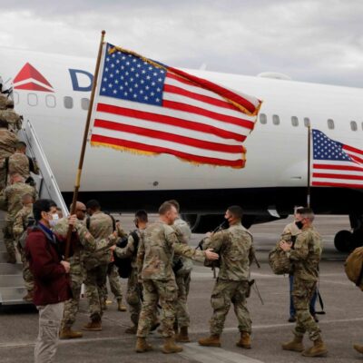 U.S. Army service members assigned to the 1st Armored Brigade Combat Team, 3rd Infantry Division, board a flight to Germany, from Hunter Army Airfield, Georgia, February 28, 2022. Picture taken February 28, 2022. U.S. Army/Spc. Anthony Ford/Handout via REUTERS THIS IMAGE HAS BEEN SUPPLIED BY A THIRD PARTY. – RC2EUS97NIHJ